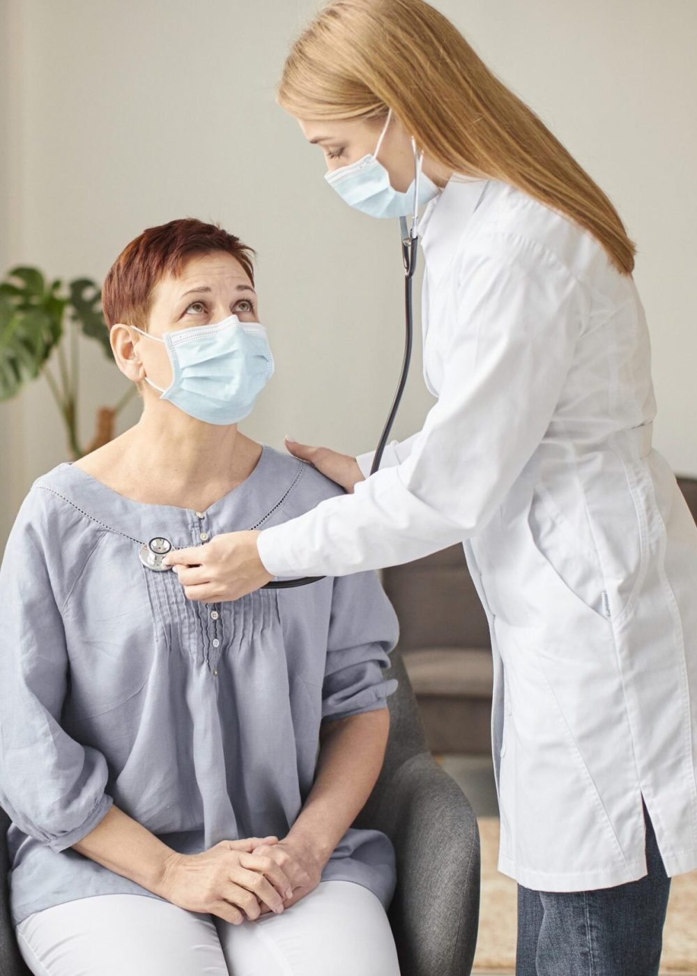 elder-patient-with-medical-mask-being-checked-by-covid-recovery-center-female-doctor